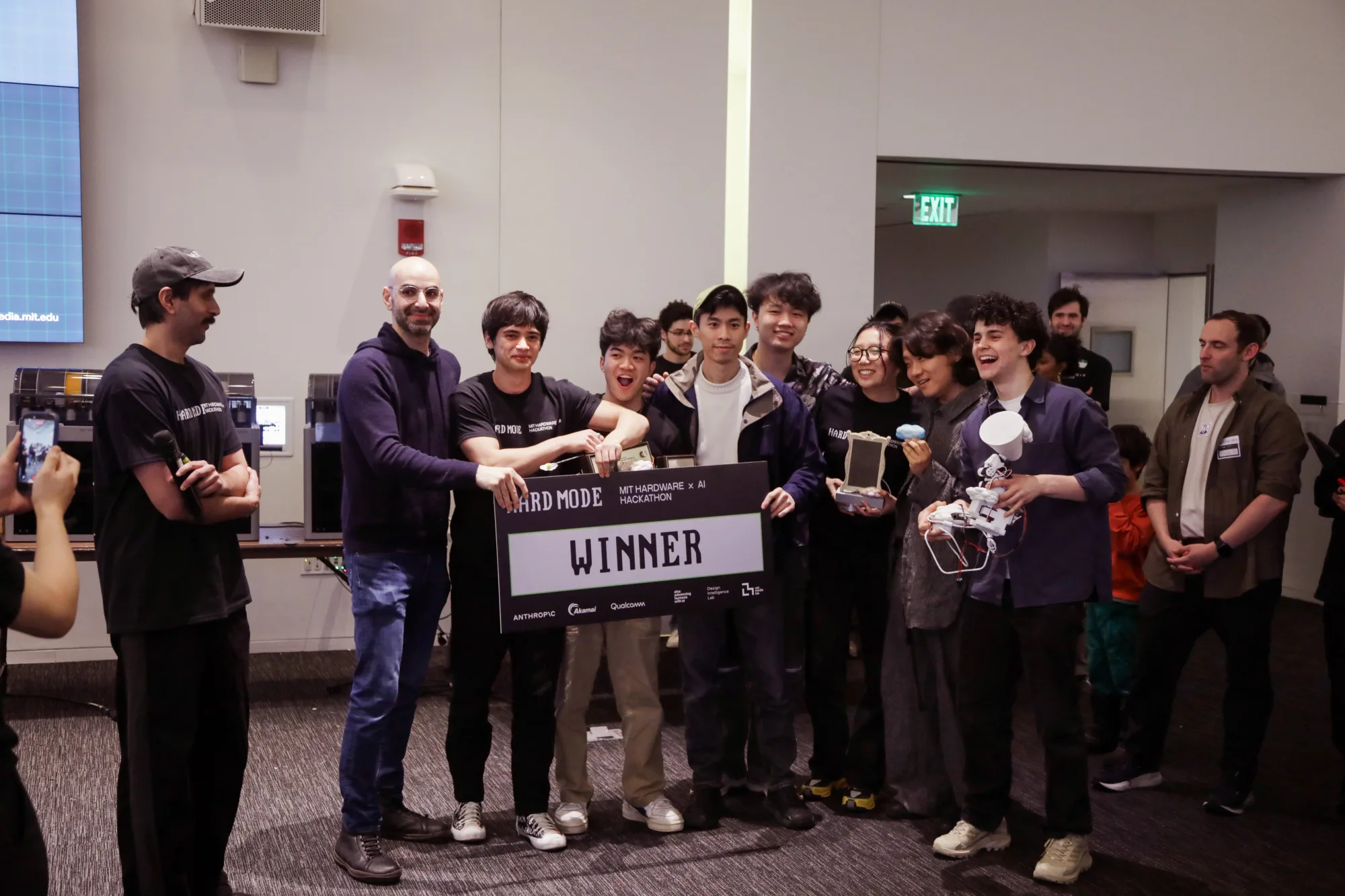 HARD MODE winning team on stage with the WINNER cheque